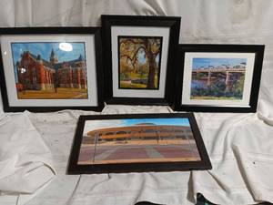 lot 33860 image: Collection of four framed architectural and landscape art prints, which resemble the regional matted prints and paintings of a local artist. Set in black wooden frames with white