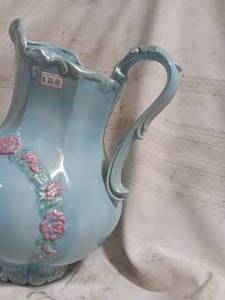 lot 33868 image: Vintage porcelain pitcher or creamer in a Victorian style, featuring a pale blue glaze with a raised pink rose floral motif and an ornate handle