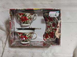 lot 33872 image: Grace Teaware Poinsettia Chintz Gold Bone China Tea Cup and Saucer set, featuring a festive red holiday poinsettia design with elegant gold