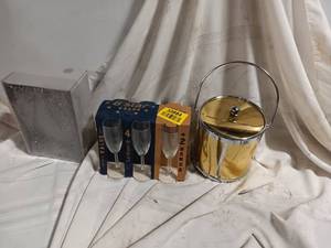 lot 33884 image: Vintage gold and glassware bar set, likely featuring a mirroredbrushed gold ice bucket with a metal handle and matching mid-century style drinkware