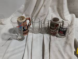 lot 33887 image: Collection of vintage clear glass beer steins and mugs, including heavy paneled styles and advertising glassware