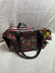 lot 33904 image: Betsy Johnson  multi-colored patterned duffeltravel bag with dark top handles and a zipper closure.