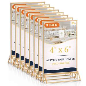 lot 73697 image: 8 Pack 4�6 Clear Acrylic Sign Holder with Gold Borders and Vertical Stand, Double Sided Table Menu Holders Picture Frames for Wedding Table Numbers, Restaurant Signs, Photos and Art Display - Retail $25