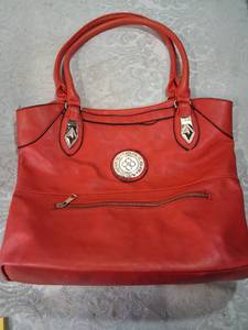 lot 101 image: Red Tote Bag with Decorative Medallion and Zip Pocket