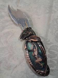 lot 104 image: Stainless Steel Folding Knife Eagle Head Handle with Inlaid Stone