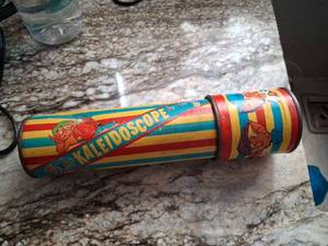 lot 145 image: Kaleidoscope Tin Toy with Colored Turning Disk