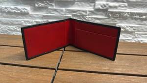 lot 51 image: Coach Bifold Wallet (Black & Red)