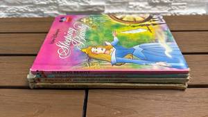 lot 86 image: Walt Disneys 4-Book Lot Sleeping Beauty Mr Toad Pinocchio Bambi