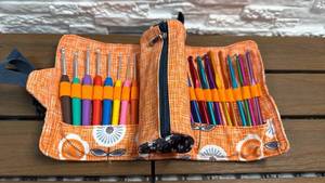 lot 101 image: Crochet Hook and Craft Tool Set with Orange Canvas Roll Organizer