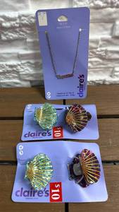 lot 178 image: Claires Aquarius Zodiac Necklace and Shell Claw Hair Clips Set