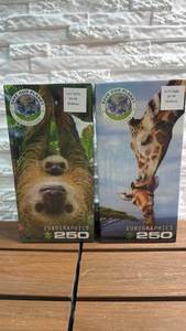 lot 226 image: Eurographics 250-Piece Puzzle (Lot of 2) Save Our Planet Collection - Sloths & Giraffes