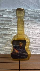 lot 306 image: Guitar-Shaped Plastic Bank w Elvis Print