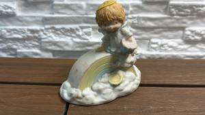 lot 354 image: Katybeth The Porcelain Figurine Child on Rainbow Cloud