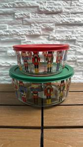 lot 366 image: Food Storage Containers (56oz & 29oz) with Nutcracker Design 2-Pack Red & Green Lids