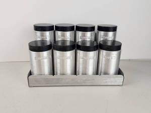 lot 102 image: 8-Piece MCM Aluminum Spice Jar Set with Metal Stand Nutmeg Mustard Cayenne Cinnamon