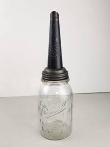 lot 120 image: Vintage The Master Motor Oil Jar