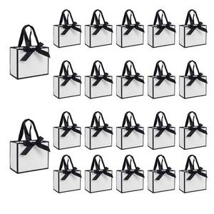 lot 39014 image: 50 PCS Small White Black Gift Bags with Handles, 6.4�3.1�5.1 Inch Thank You Bags with Bow Ribbon for Baby Shower, Bridal Shower, Wedding, Party Favors, Fathers Day - Retail $30