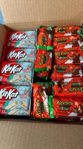 lot 2084 image: Lot of 56 KitKat Peppermint Sticks and 25 Reese��s Peanut Butter Trees.