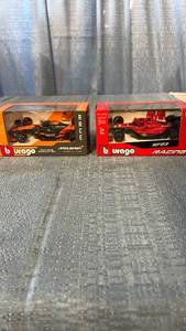 lot 3037 image: Burago Die-Cast Formula 1 Race Cars Lot of 2 Models 143