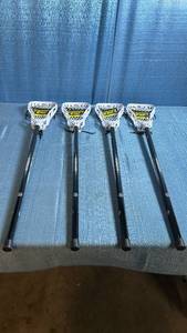 lot 8055 image: Warrior 35 Junior Lacrosse Player Stick 4-Pack