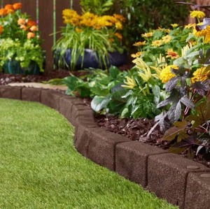 lot 53 image: 48 In. X 2.5 In. X 3 In. Brown Smartloc Cobblestone Rubber Edging (2-Pack)