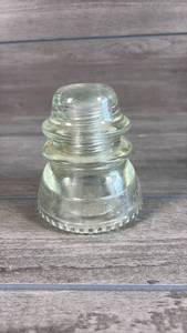 lot 185 image: Glass Electrical Insulator with Beaded Base Design