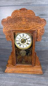 lot 192 image: Carved Wood Wall Clock with Roman Numeral Dial and Decorative Panel