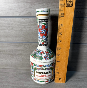 lot 266 image: Metaxa 1988 100th Anniversary Olympiad Commemorative Bottle