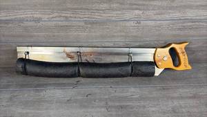 lot 490 image: Hand Saw with Yellow Handle and Metal Blade