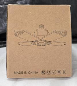 lot 979 image: Screw-in deformable LED shop or garage light.