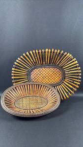 lot 30 image: Two Woven Oval Baskets with Radiating Stick Design