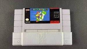 lot 57 image: Super Mario World on the Super Nintendo Entertainment System (SNES), featuring the classic label art of Mario riding Yoshi
