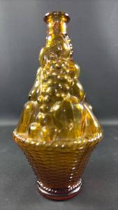 lot 89 image: Vintage mid-century Italian Empoli amber glass decanter featuring an embossed fruit basket and woven texture design
