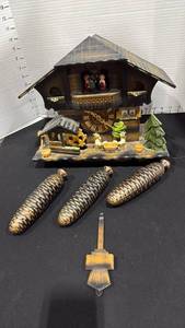 lot 1048 image: Vintage Schwarz musical chalet-style cuckoo clock with weights and pendulum 12x13.5x7