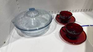 lot 1079 image: Casserole dish and two cranberry colored cups and saucers