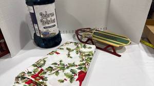lot 1166 image: Plush throw new, Festive Flyer sled decor and tablecloth