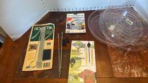 lot 2018 image: 2 plastic 12 inch saucers, plant hooks and plant pulley