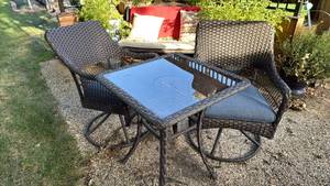 lot 2031 image: 2 swivel chairs 35x23x25, seat 19 inches and patio table 29x26x26 part of webbing needs redone on table, pu after 6pm on 911 address provided to winning bidder