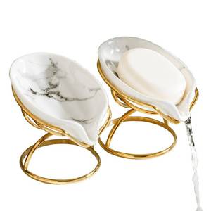 lot 141 image: Dobbyby Leaf-Shaped Soap Dish �� Ceramic Soap Bar Holder with Self-Drainage System �� Bar Soap Holder for Shower, Bathroom Sink, Kitchen �� Soap Dish with Stainless Steel Stand (White-Gold-2 Pack) - Retail $28