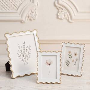 lot 209 image: Novabright 3 Pack Scalloped Picture Frame Set, Elegant White Resin Photo Frames with Gold Wavy Trim, Decorative Vintage Frames for Tabletop & Wall Display, Gallery Wall Home Decor Gifts - Retail $37