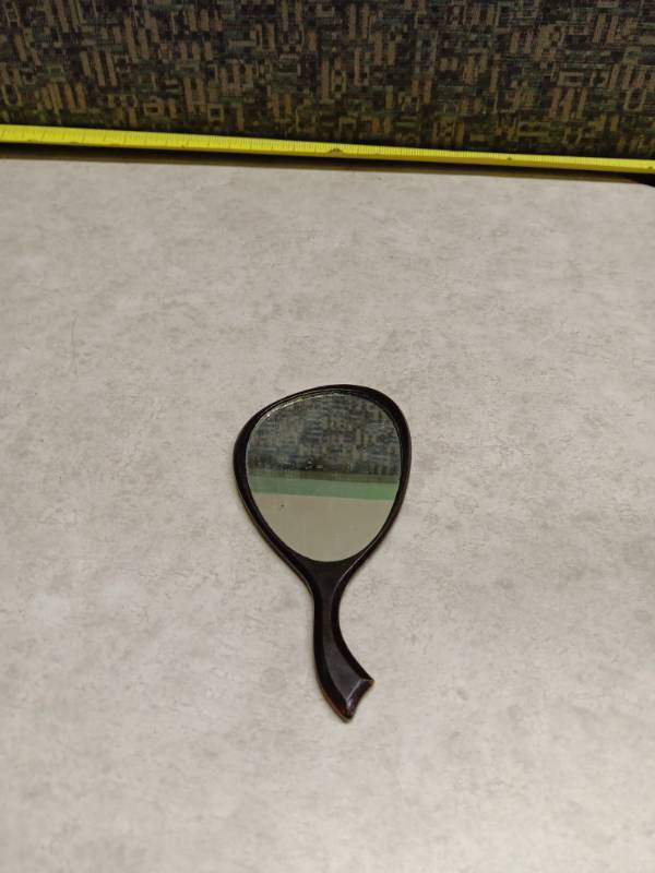 lot 1063 image: Miniature Hand Mirror with Black Handle