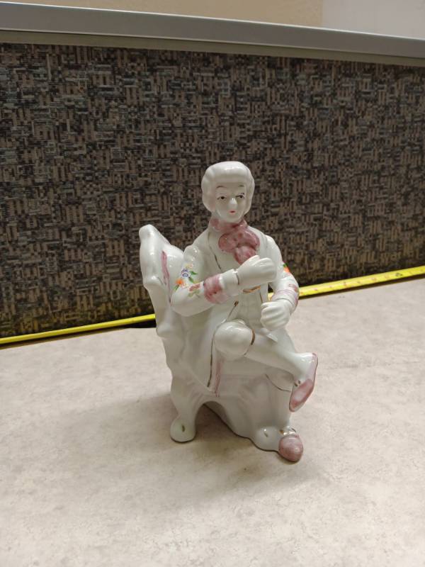 lot 1125 image: Porcelain Figurine Child on White Chair w Pink Accents