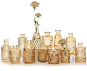 lot 498 image: SUPMIND Glass Bud Vases Set of 12, Small Gold Amber Flower Vases in Bulk - Retail $28
