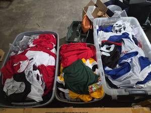 lot 235 image: Lot of Sports Jerseys and Apparel Multiple Colors Sizes