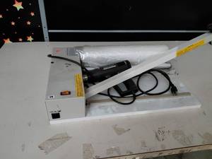 lot 79 image: Shrink wrap machine 2 in 1 hand wrapping machine with heat gun