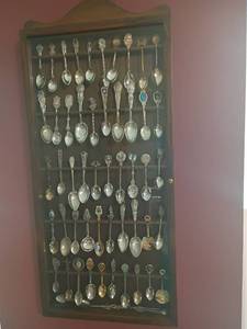 lot 907 image: Spoon Collection and Holder.  30 x 14 x 2.  Located in basement