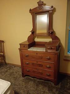 lot 926 image: Vintage Victorian or Eastlake Style Marble Top Dresser with Mirror.  3 Drawers with 2 Handkerchief Drawers.  76 x 40 x 19.   Located in basement