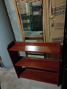 lot 930 image: Wooden Book Shelf and Mirror.  Shelf 29 x 29 x 8.  Mirror 4ft x 12.   Located in basement