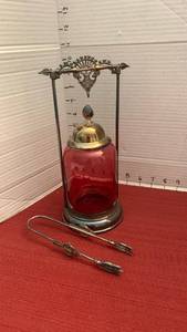 lot 1045 image: Antique Victorian pickle castor featuring a cranberry glass jar in a silver-plated metal stand with matching tongs
