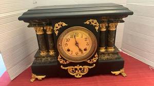 lot 1049 image: Antique Mantel Clock with Black Case, Gold Trim, and Decorative Columns